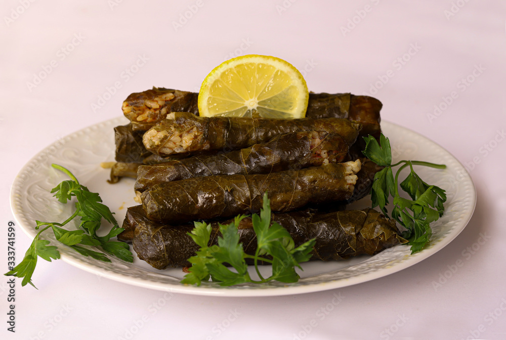 leaf wrap, vine leaf, traditional food, isolated on white, dolmades, sarmale, dolma, lemon slices, appetizer leaf wrap, vine leaf, traditional food, isolated on white, dolmades, sarmale, dolma, lemon slices, appetizer