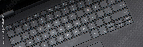 Foto Matte black on black flay lay banner with keyboard close with room for text