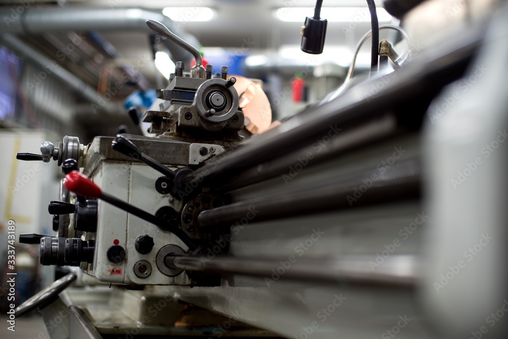 Fototapeta premium Abandoned machine metalworking lathe in a factory closing due to the pandemic virus