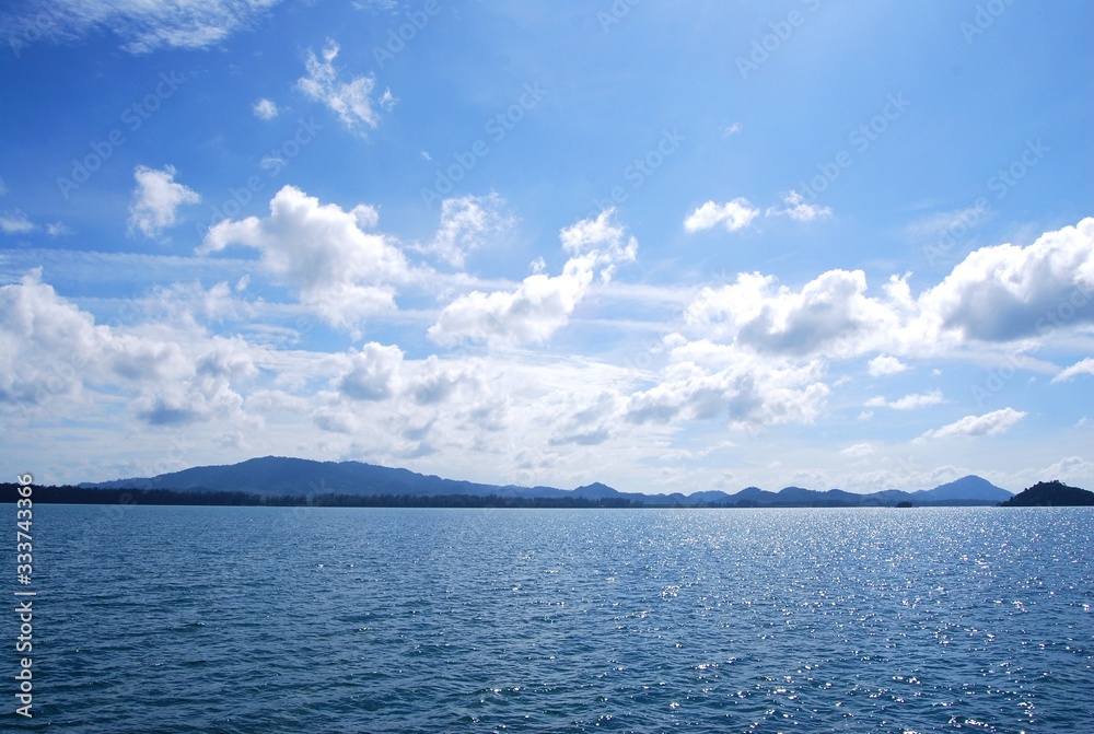The sea at the afternoon, mountains and clouds. Ranong Sea in Thailand.