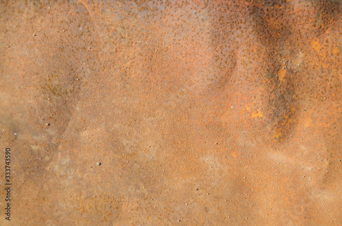 The texture of a rusty metal sheet of iron in sunlight © Kate Nick