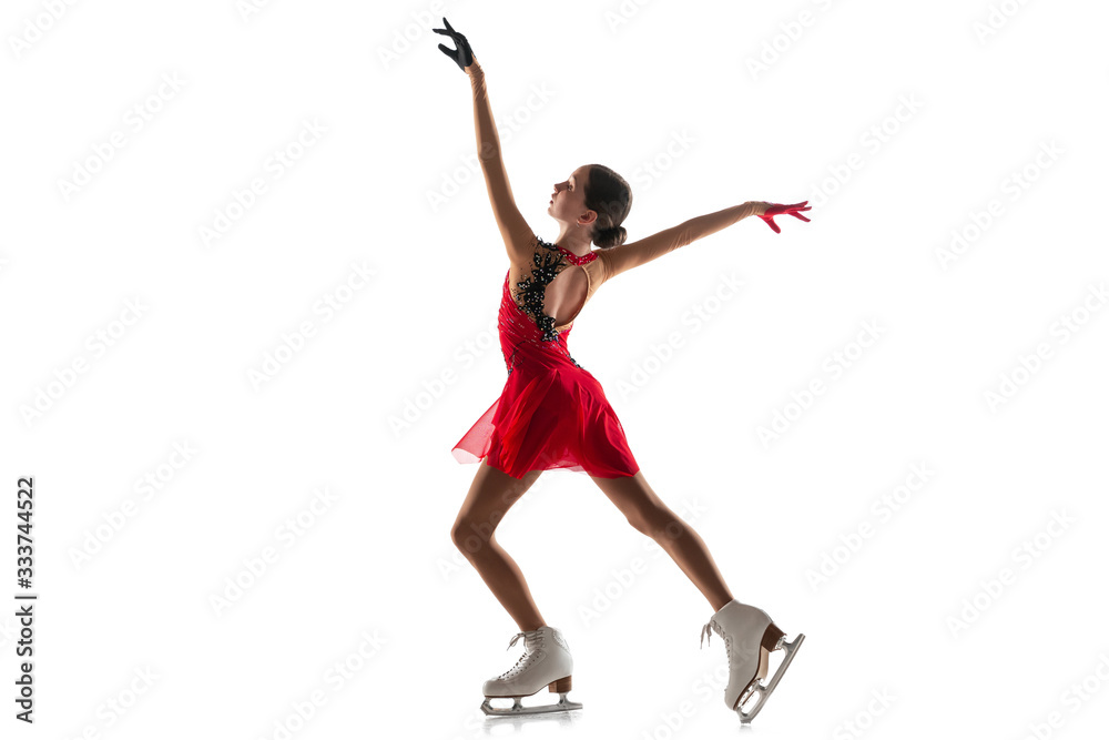 Girl figure skating isolated on white studio backgound with copyspace. Professional practicing and training in action and motion on ice. Graceful and weightless. Concept of movement, sport, beauty. Girl figure skating isolated on white studio backgound with copyspace. Professional practicing and training in action and motion on ice. Graceful and weightless. Concept of movement, sport, beauty.