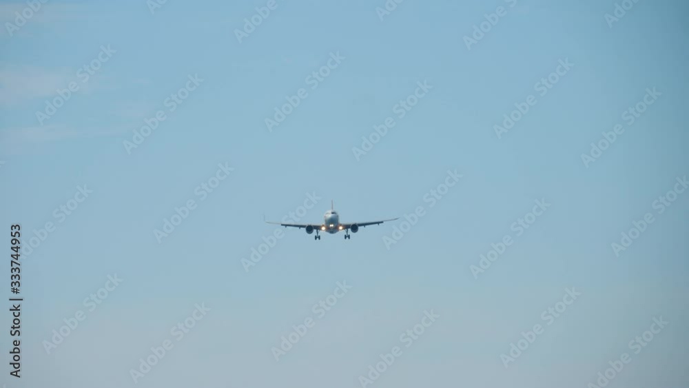 Airplane approaching over ocean before landing Airplane approaching over ocean before landing