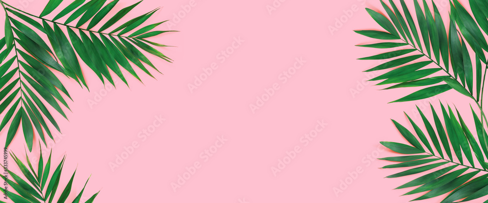 Creative flat lay top view of green tropical palm leaves on yellow paper background. Creative flat lay top view of green tropical palm leaves on yellow paper background.
