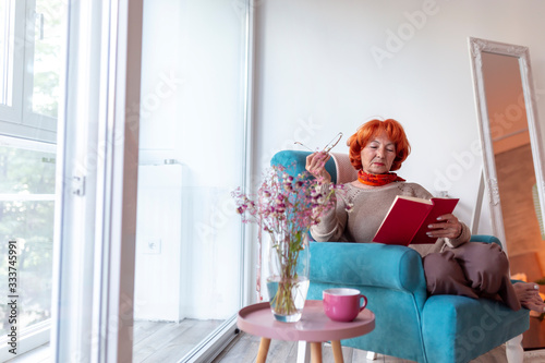 Senior woman reading a novel