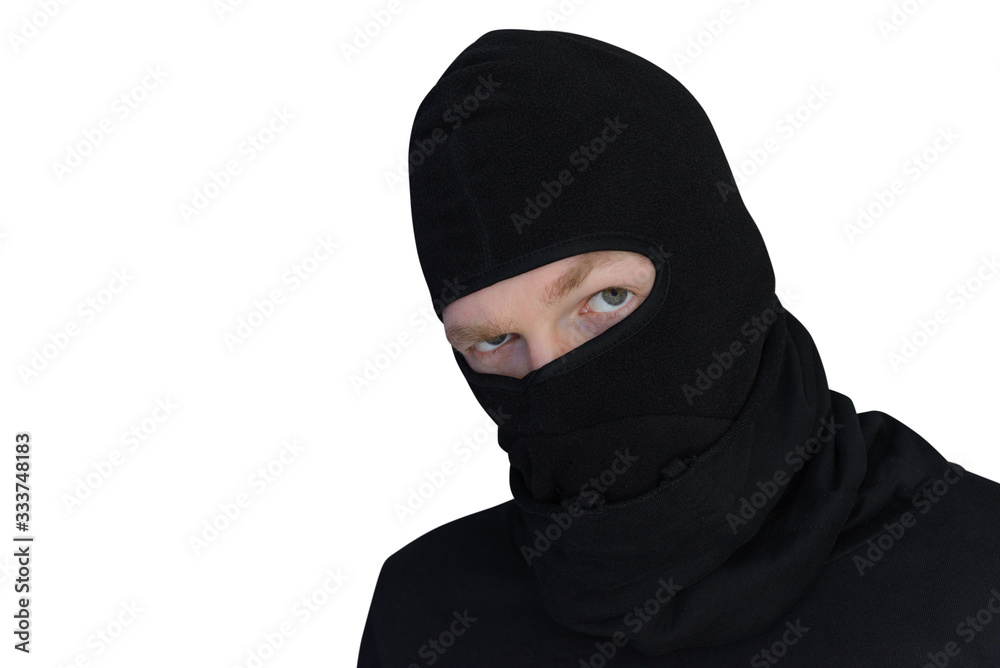 man in balaclava looks suspiciously close-up isolated on a white background