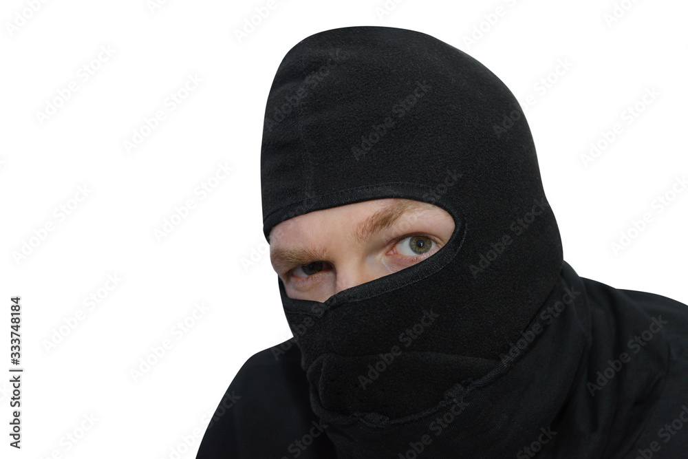 man in balaclava looks suspiciously close-up isolated on a white background