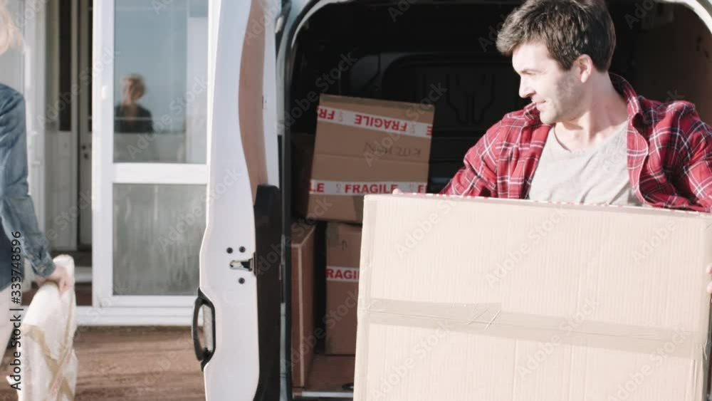 Adult Couple moving into new house with homeware
