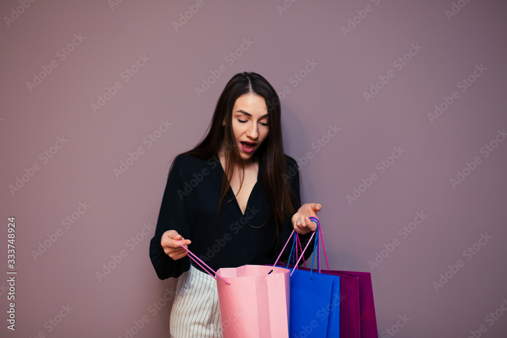 young surprised girl look at shopping