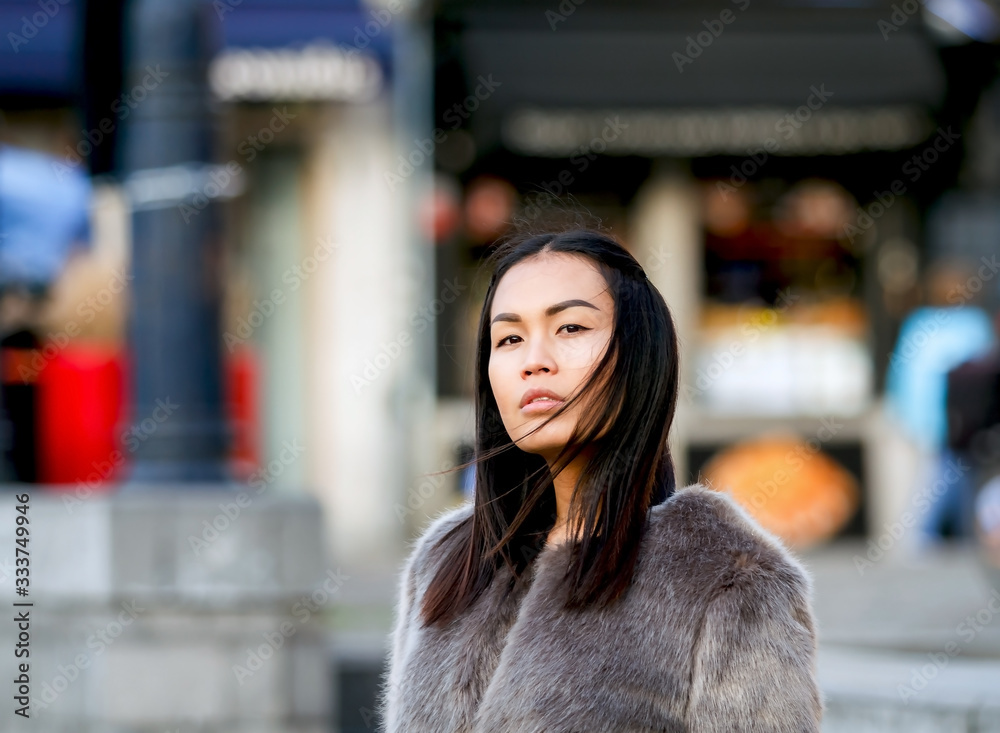 Beautiful portrait of fashionable asian woman in winter clothes 