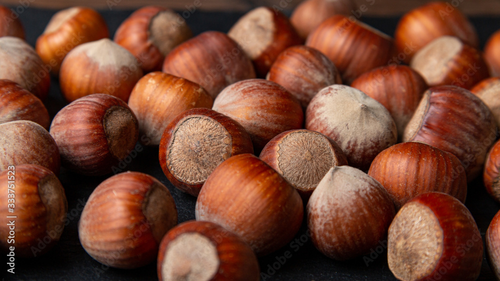 Lot of hazelnuts in shells, close up. Lot of hazelnuts in shells, close up.