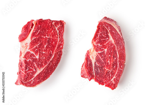 Foto Two slices of frozen beef meat for steak on a white background.