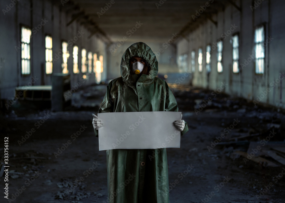 Doctor wearing protection face mask against coronavirus. Staff preventive gear. Holding a poster stay at home in hands Doctor wearing protection face mask against coronavirus. Staff preventive gear. Holding a poster stay at home in hands
