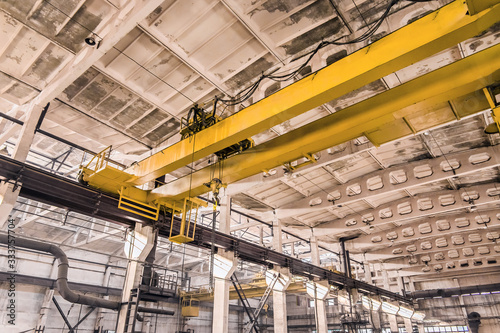 Overhead crane at an industrial plant, background production, construction site photo