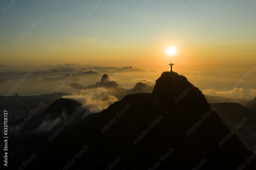 Aerial, panoramic view of Guanabara Bay and Corcovado with Christ the Redeemer statue during the sunrise in Rio de Janeiro