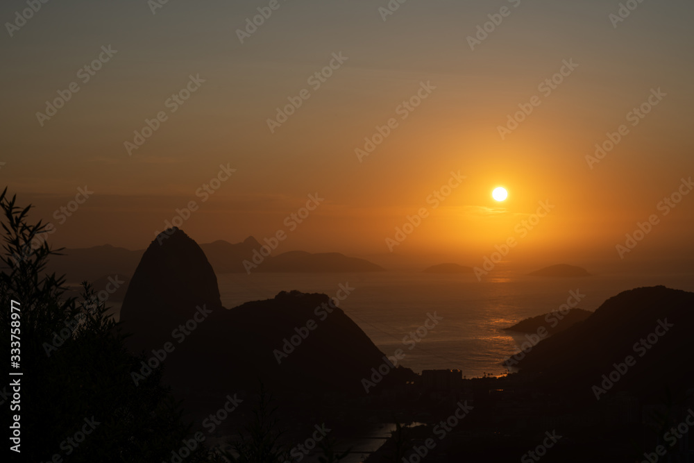 Amazing orange sunrise over the Sugarloaf Mountain in Rio de Janeiro Brazil