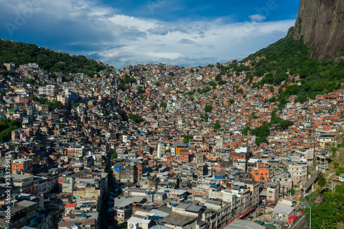 Amazing, aerial view of favela Rocinha at the foot of Dois Irmao mountain photo