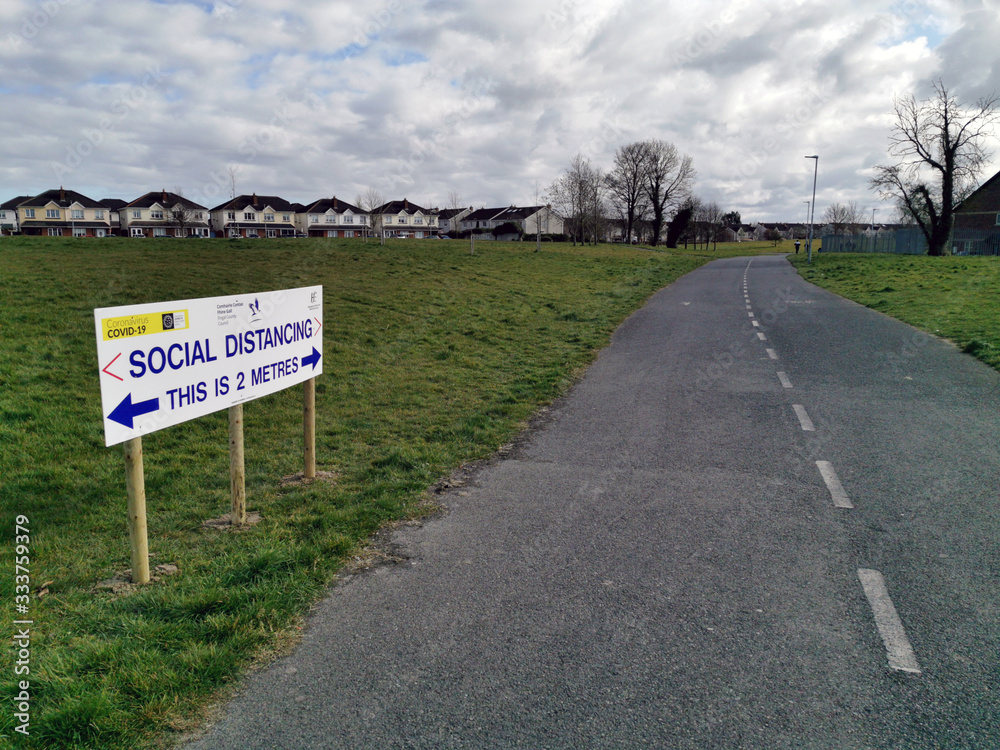 Social distancing sign in the park during Corona virus. Dublin, Ireland. March 28, 2020
