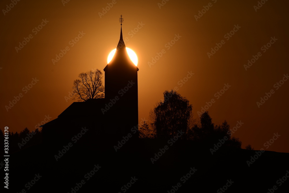 silhouette of mosque in front of sunset