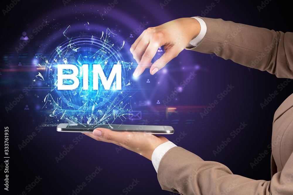 Close-up of a touchscreen with BIM abbreviation, modern technology concept Close-up of a touchscreen with BIM abbreviation, modern technology concept