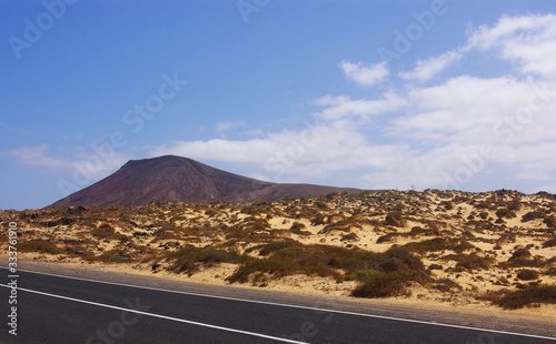 Dunes and volcanic nature road