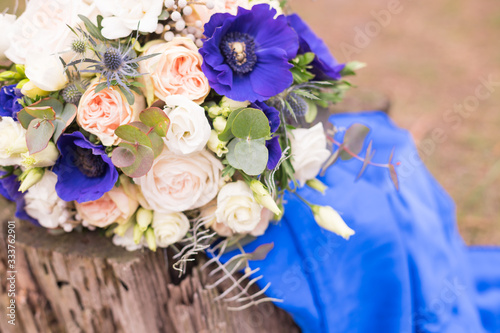 Wedding flowerst on a wood. Bridal bouquet outdoor. copy space for chic boho wedding magazines and websites, bohemian, fashion, florist and other related subjects photo