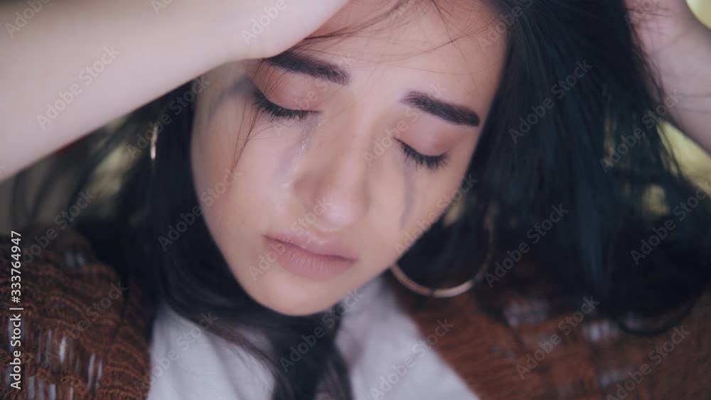 young beautiful model sad looking crying at camera and posing young beautiful model sad looking crying at camera and posing