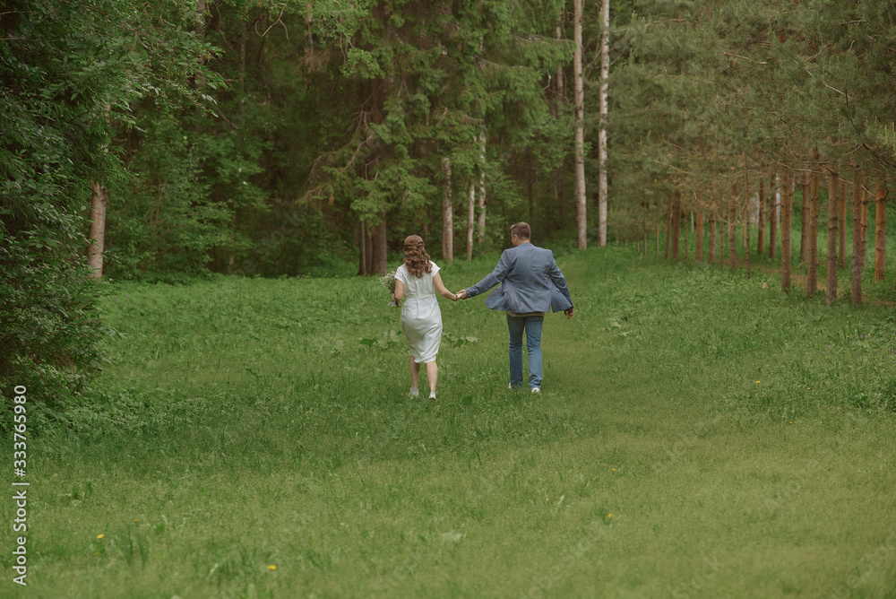 happy bride and groom run in the park happy bride and groom run in the park