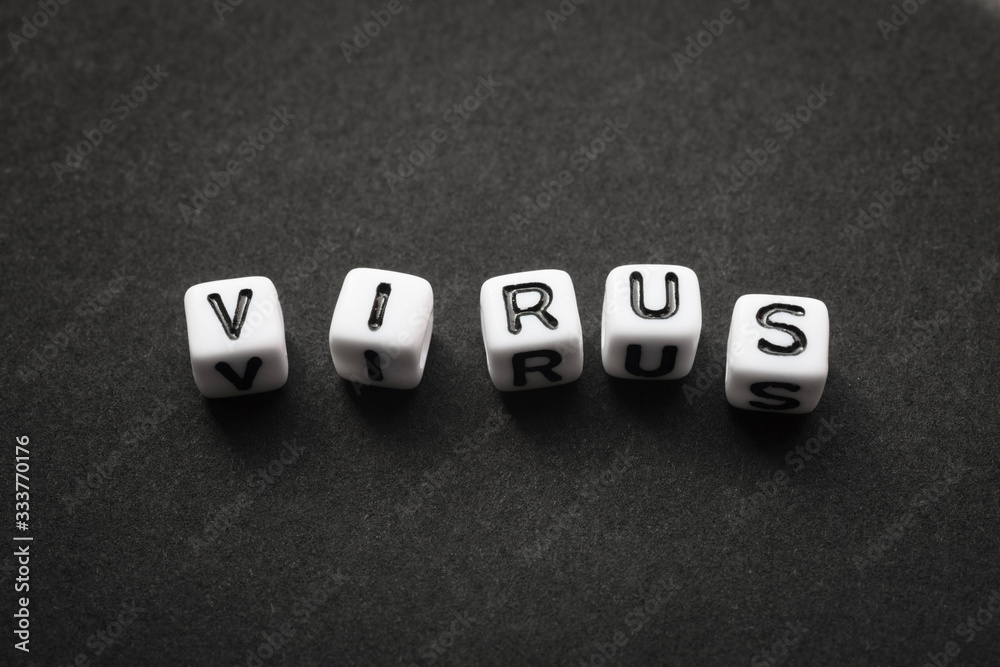 Virus as a text with letters, corona virus with word cubes on a dark grey background with space for text, no people, mock up Virus as a text with letters, corona virus with word cubes on a dark grey background with space for text, no people, mock up
