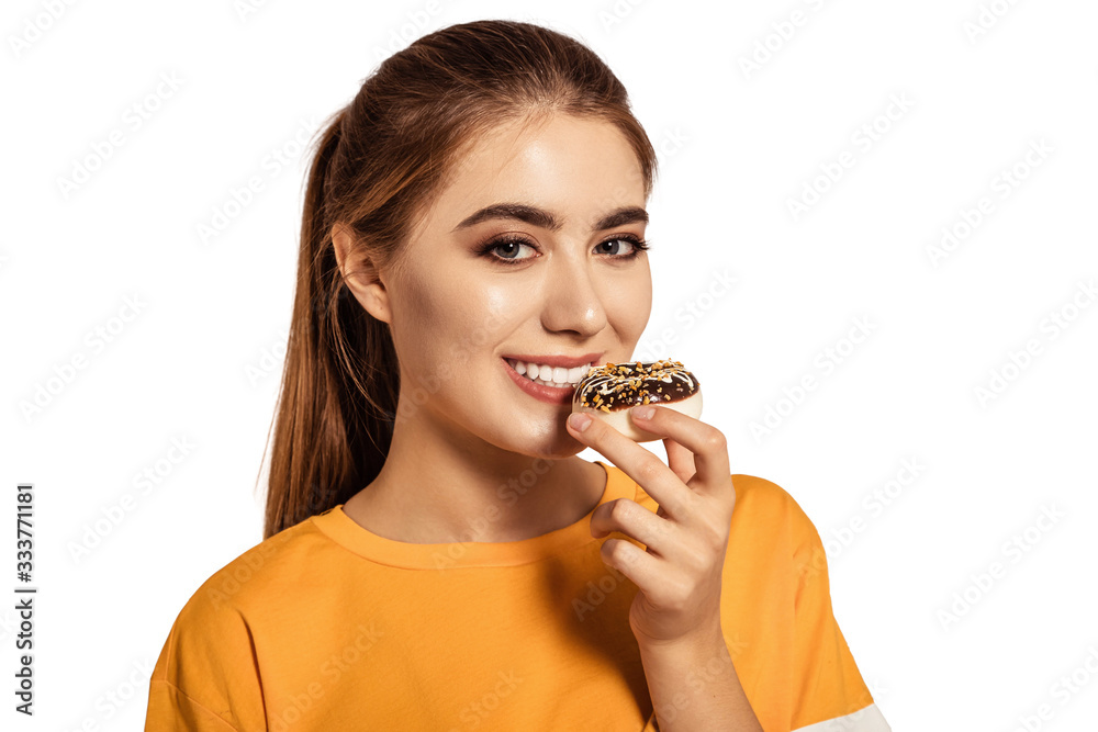 Beauty girl holding blue donuts laughing over white background. There is a dessert, a smile. Beautiful Happy Young woman on party with doughnuts in a yellow shirt. Joyful model Celebrating. Beauty girl holding blue donuts laughing over white background. There is a dessert, a smile. Beautiful Happy Young woman on party with doughnuts in a yellow shirt. Joyful model Celebrating.