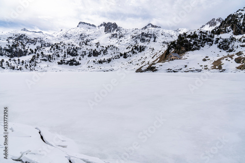 Colomers lake and refuge in National Park of Aigüestortes and lake of Sant Maurici.