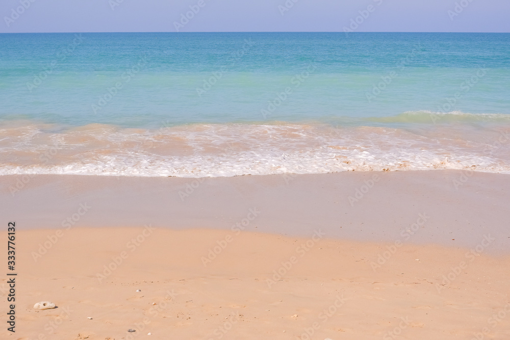 Amazing Tropical beach, sand and sun in blue sky. Summer nature scene.Beautiful seascape with white sand on the beach and blue water on the sea. Travel concept.Nature background.Summer holiday concept