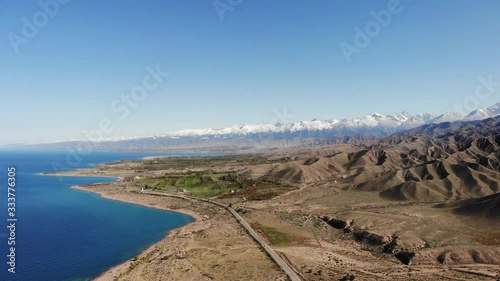 Fairytale canyon entrance with view on lake and mountains