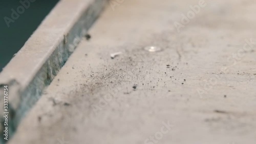 Concrete workshop - pieces of concrete are shaking because of vibration on the surface photo