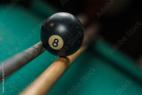 Billiards balls and cue on billiards table. Billiard sport concept