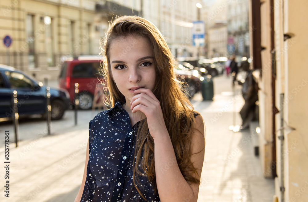 Portrait of teenage girl. Girl with a birthmark over her lip. Spring sunny concept. 8 March. Happy Women's Day. Beautiful girl walking in the city. Portrait of teenage girl. Girl with a birthmark over her lip. Spring sunny concept. 8 March. Happy Women's Day. Beautiful girl walking in the city.
