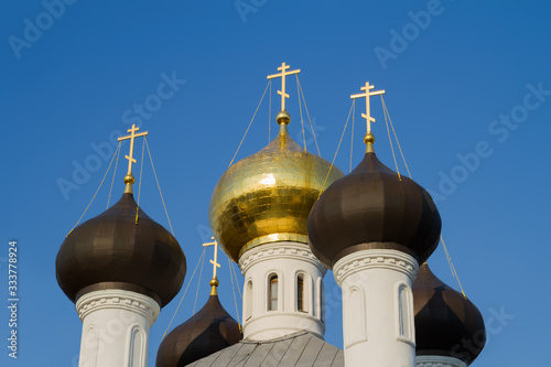 Golden crosses and domes of russian orthodox church. photo