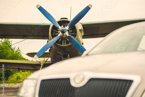 Old green plane and car