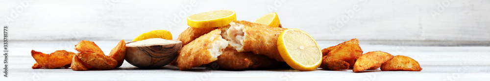 traditional British fish and chips consisting of fried fish, potato chips and mayonnaise traditional British fish and chips consisting of fried fish, potato chips and mayonnaise