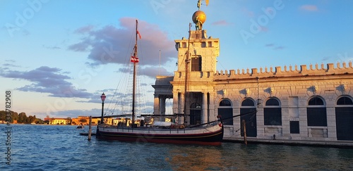 Sailing ship near Punta della Dogana, an art museum in an old customs building in Venice.