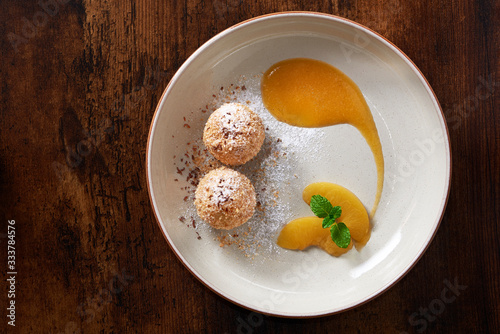 Homemade curd cheese dumplings with apricot, chocolate and mint