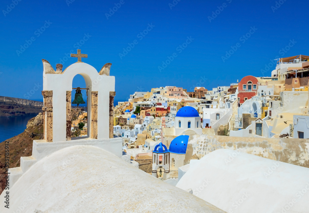 Beautiful cityscape of Santorini with white and blue buildings on summer sunny day