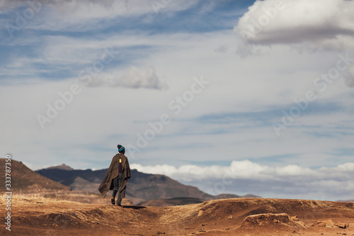 Unidentified Basotho man wearing Lesotho traditional blanket in the Malluti mountains