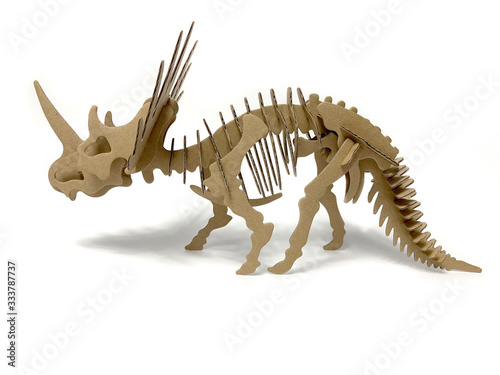 3d cardboard dinosaur puzzle on a white background. children's designer from cardboard. 3D volume puzzle. 3d puzzle toy. children`s constructor on a white background isolated. side view 