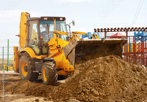 Concept of the tractor, the tractor digs and buries a trench