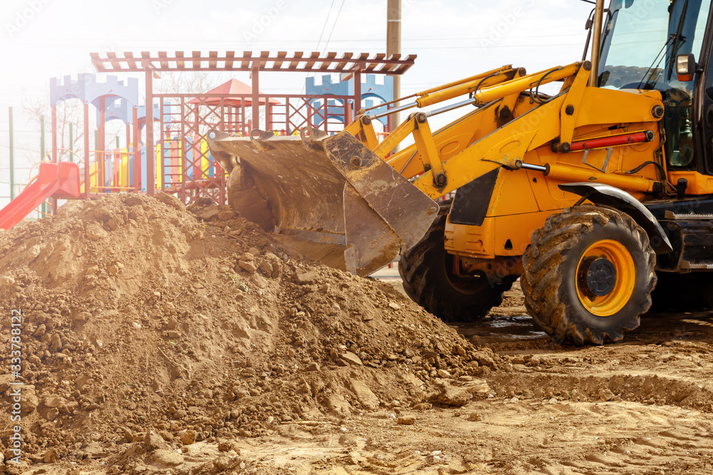 Fototapeta premium Excavator. Digger machine digging earth in construction site