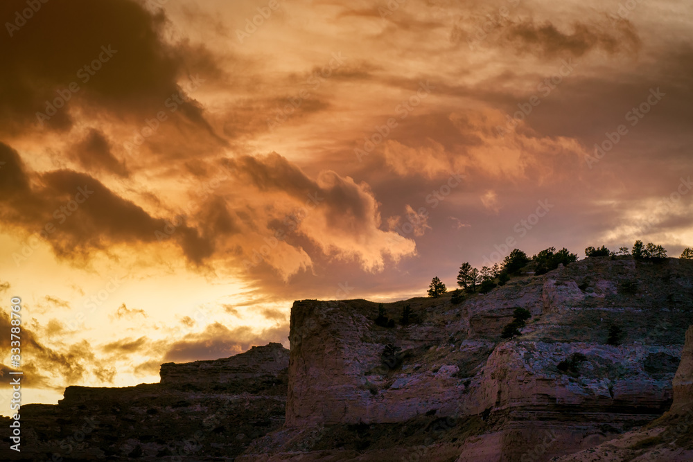 dramatic sunset clouds with mountain silhouette 