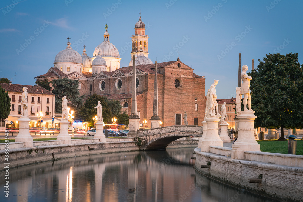 View of Basilica Santa Giustina and canal with statues on square Prato della Valle in Padova (Padua), Veneto, Italy
