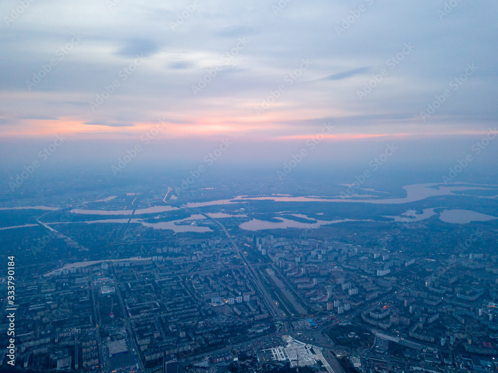 Sunset over Kiev and the Dnieper River, view from the left bank. Aerial drone view.