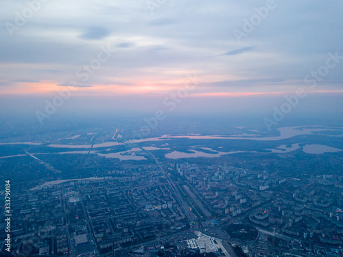 Sunset over Kiev and the Dnieper River, view from the left bank. Aerial drone view. © Sergey